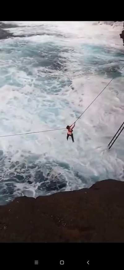 Cliff diving in heavy swell, Hawaii