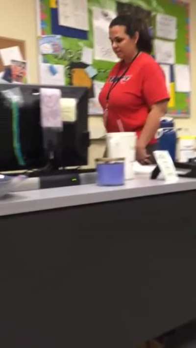 Student scares teacher by grabbing her ankles.