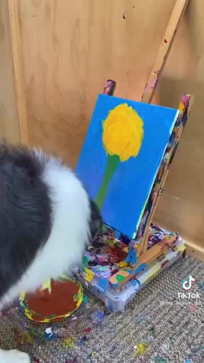pup paints a flower