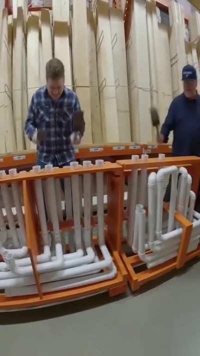 Performing the Home Depot theme inside Home Depot using DIY items.