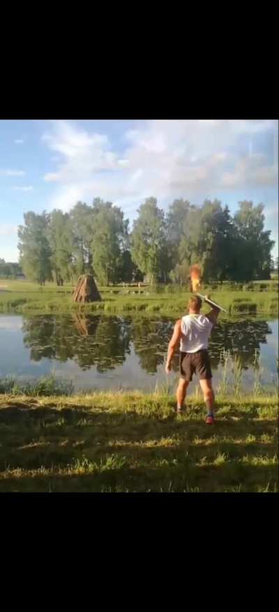 Former javeline throw world champion lights his home village bonfire with a burning javelin.