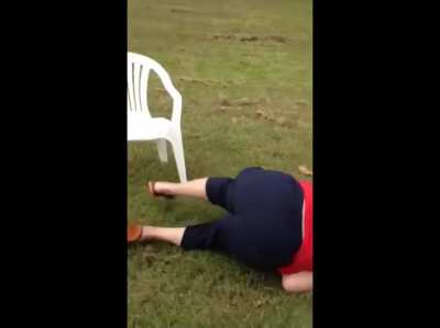 A dog is provoked into attacking it's owner by the owner doing the water challenge. The dog latches onto the owner's face but the rest of the family is there to help her.
