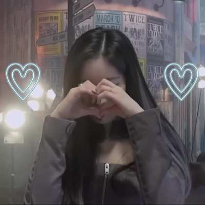 Shy Dahyun making a hand heart