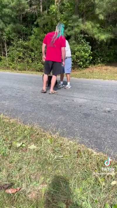 “Matter of fact, he wants to goddamn give you some lovin.” Drunk man walking a Pomeranian argues with his neighbor in the middle of the road
