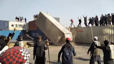 Protestors in Pakistan removing containers to reach their destination of the protest for the release of Imran Khan (political prisoner)