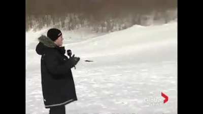 WCGW standing in front of racers on sleds