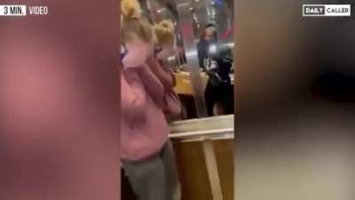 Woman in elevator gets emotional over alleged incorrect mask use.