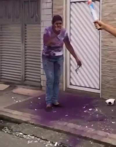 Woman stays too close to the gender reveal soccer ball