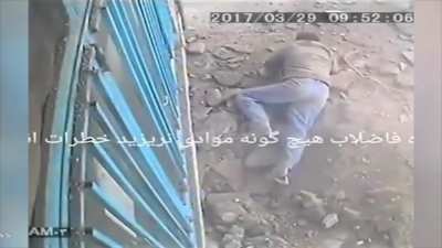 throwing a cigarette down a hole
