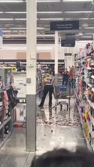 Woman destroying items in a store