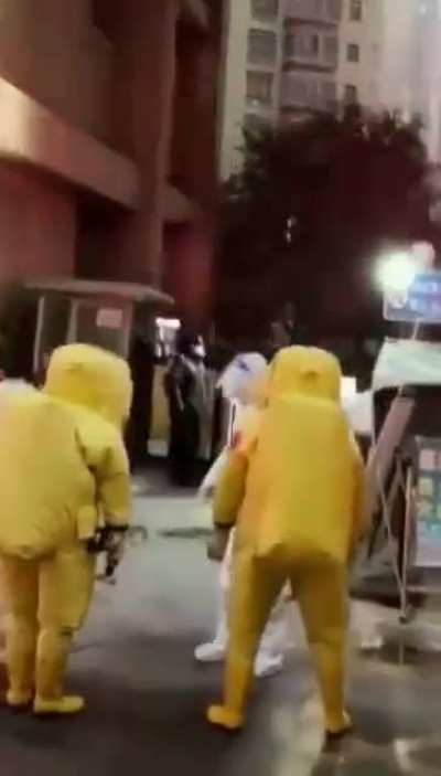 Workers wearing hazmat suits as Hemorrhagic Fever hits Xi'an city in northwest Shaanxi province