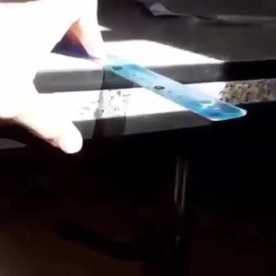 Ruler vibrating under sunlight
