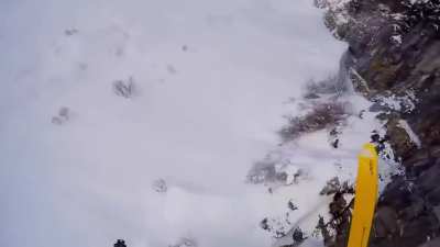 Skier falls from a cliff