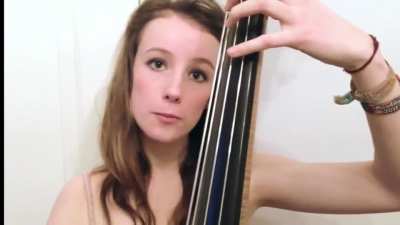 Girl plays double bass wearing only underwear