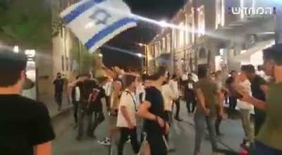 Israeli Jews chanting “Death to Arabs” in central Jerusalem. Police later arrested 6 on suspicion of attacking Arabs passers-by