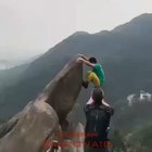 What is with the fascination in hanging off of rocks?