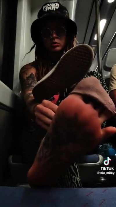 Tattooed girl shoe removal