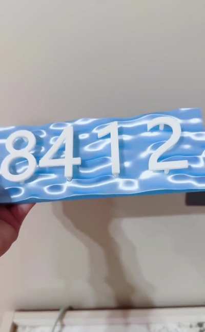 3D printed an ocean-themed door sign for my new home