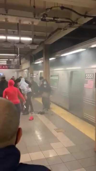 Passengers rushing out of the subway car as it pulls into the station 36st Sunset Park where multiple people were shot - Brooklyn, NYC