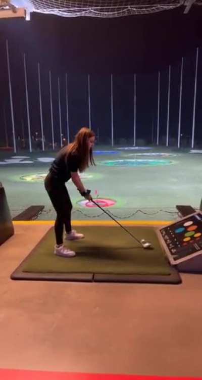 Girl tries golfing