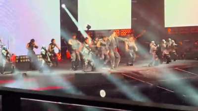 Unitree robots doing Webster flips and dancing at a concert