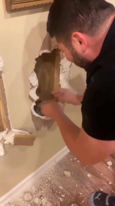 breaking drywall