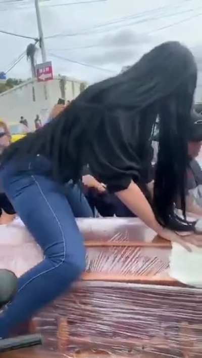 Woman twerks on boyfriend's casket