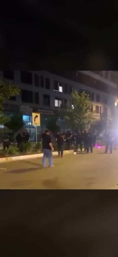 Police shoot protestor point blank in the face with rubber bullet(?) after pepper spraying
