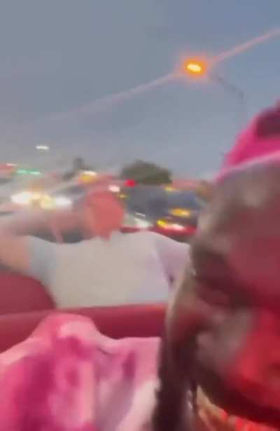 Man stops traffic to ask if his wife can get a video of him in the back of a lowrider
