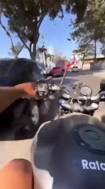 Revving lane splitter revs bike into car