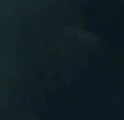 Jumping into a pool through a basketball hoop