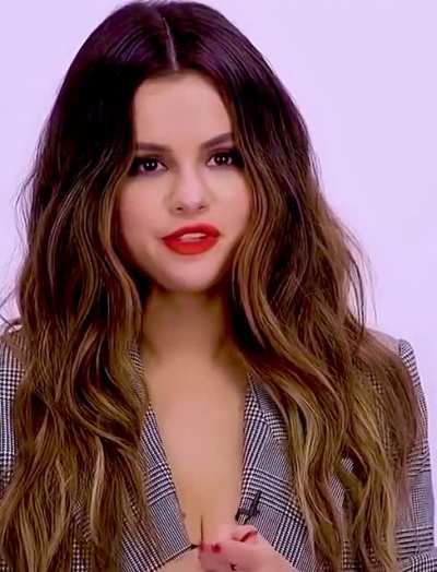 Red lips and cleavage. A winning combination..