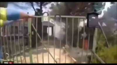 Paramedic opens fence for firefighters 