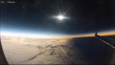 solar eclipse occurring mid-flight