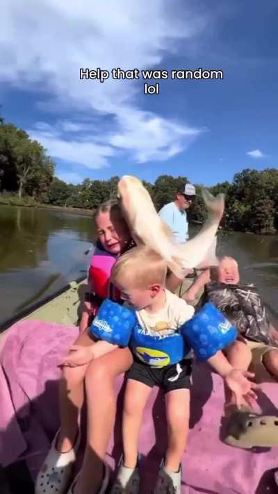 A family enjoying their time on a boat at sea