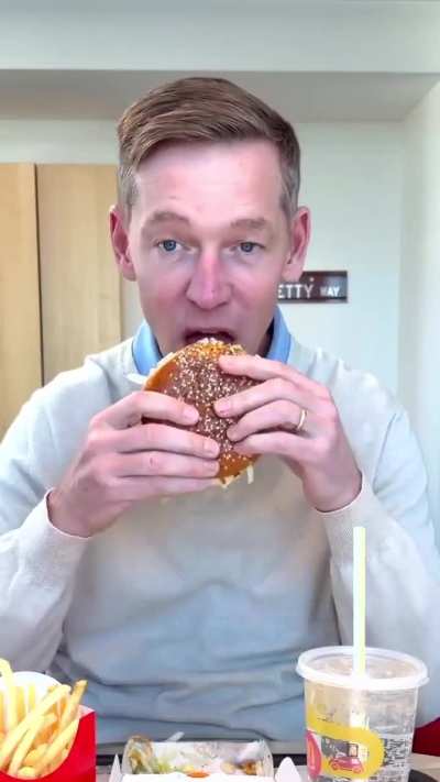 McDonald’s CEO Chris Kempczinski goes viral after seeming reluctant to eat his own burgers—he takes a tiny bite, looks uncomfortable, and calls the food ‘product.’