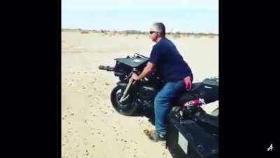 A motorcycle with a minigun
