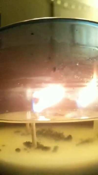 Candle burning from the other side of the wax