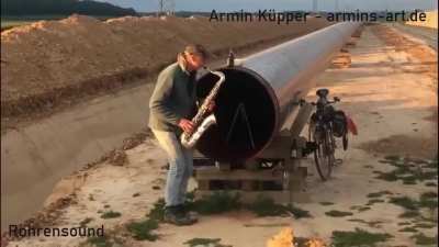 This guy playing the sax in front of a pipeline [Armin Küpper]