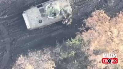 Ukrainian drone bombs russians gathered around APC