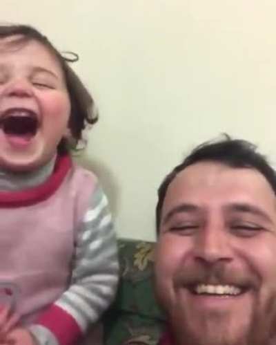 a Syrian father who started playing with his daughter when each shell fell to make her think that these sounds are fireworks. According to him, the terrifying sounds of bombs may make her mentally ill when she is at this young age, and this is the only so