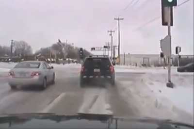 What's worse than running a red light and hitting a car? Running a red light and hitting a police car, of course.