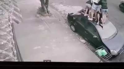 6 people jump on car to escape pit bull but it doesn't give up