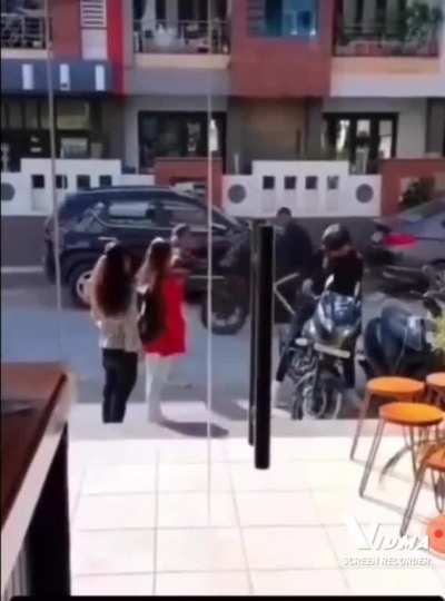Lover's quarreling before a cofee shop