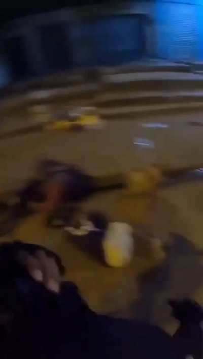 Ecuador, policeman stops robbers getting off a bus and stands by while bystander beats them up