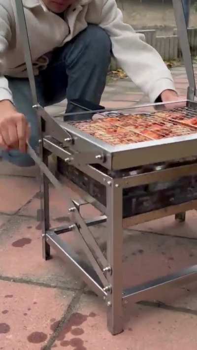 This rotating charcoal grill