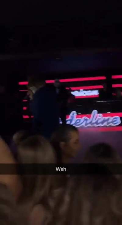 Girl gargles on the Joker’s mike at the club