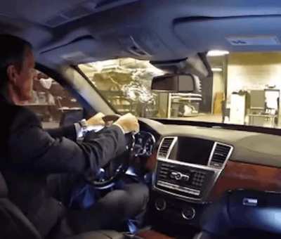 CEO of bulletproof car company taking shots from an AK to prove its security.