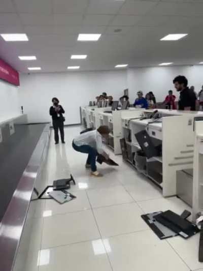 Woman destroys computers at airline's counter as a complaint of a cancelled flight she says 