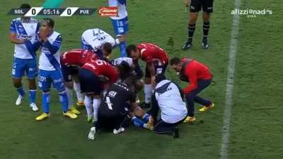 Soccer player snapped his ankle while doing a tackle.